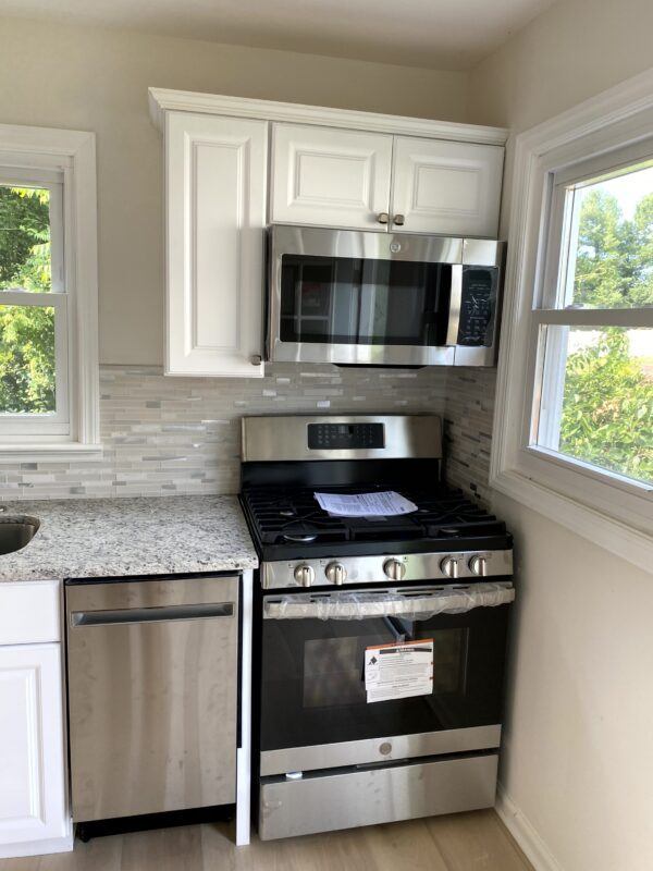 warm butcher block countertop installed in traditional kitchen design
