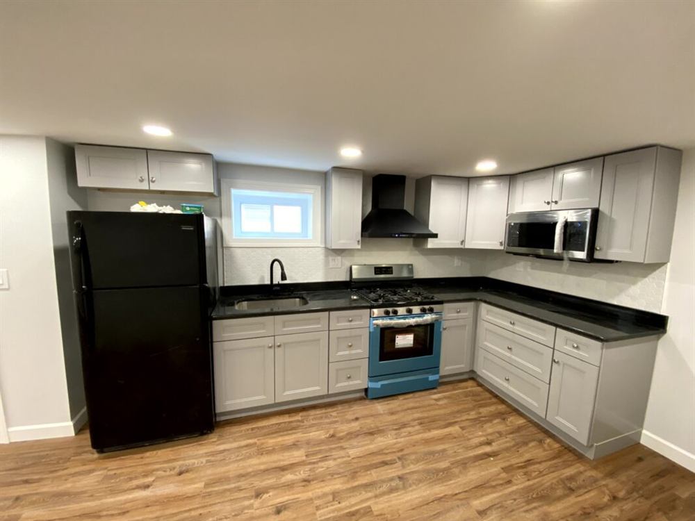 white subway tile backsplash with dark grout in contemporary kitchen
