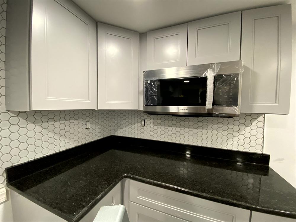 professional kitchen floor installation with tile layout pattern