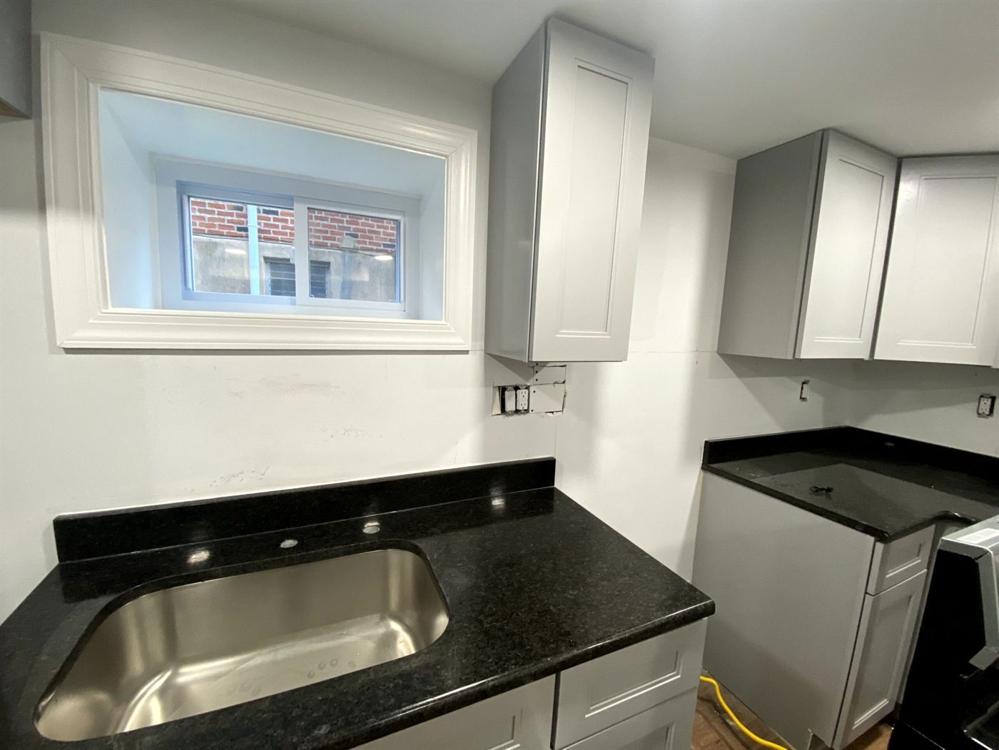 Finished basement with kitchenette in a Philadelphia row home